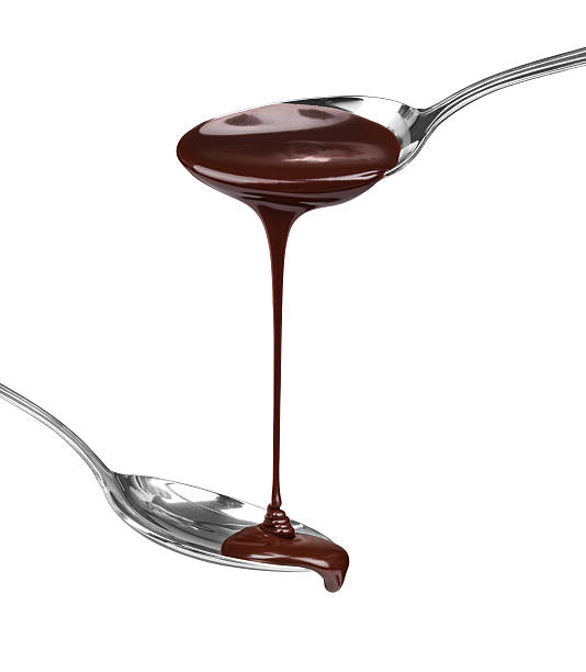 istock hot chocolate pouring stream with a spoon on a spoon on a white background 471597356