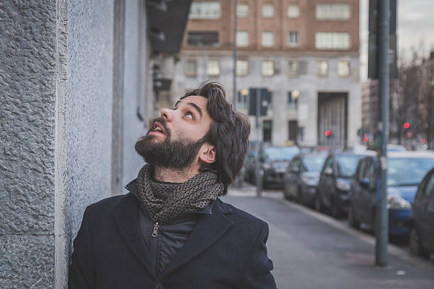 istock Young handsome bearded man posing in the city streets 471598624