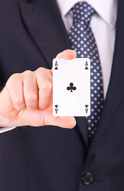 istock Businessman showing playing card. 471598765