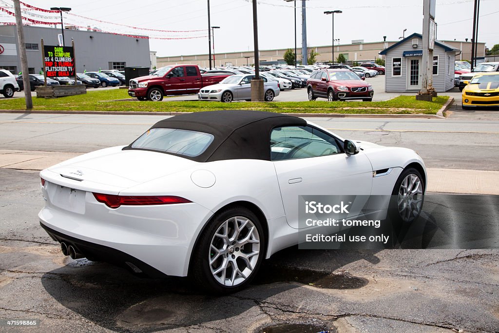 Jaguar F-Type Convertible Halifax, Nova Scotia, Canada - June 23, 2013: A Jaguar F-Type convertible parked outside a car dealership.  Other dealerships and vehicles visible across street in front of vehicle.  The Jaguar F-Type is a two-seat convertible launched in 2013 by Jaguar.  It is available with three engine configurations including two V6 and a V8. (as of 2013) Car Stock Photo