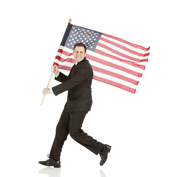 istock Smiling young businessman with American flag 471600023