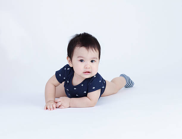 istock Thai baby try to crawling isolates 471600778