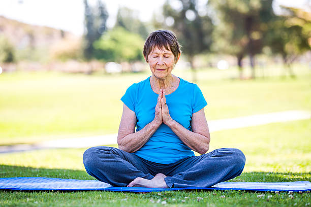 istock Senior Woman Practicing Yoga 471601203