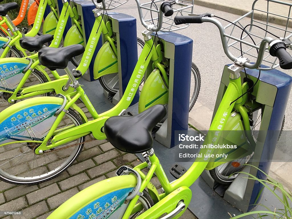 Public Bikes Zhenjiang, Сhina - June 14, 2013:The public bikes in downtown. Costumers can use this bikes around Zhenjiang downtown for 1RMB-Chinese Yuan. Photo taken from Zhenjiang City, Jiangsu Province, China. Photo taken with Apple, iPhone. 2013 Stock Photo