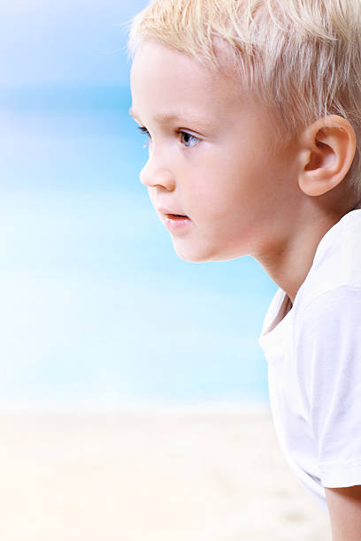istock Beautiful little boy on the beach 471603059