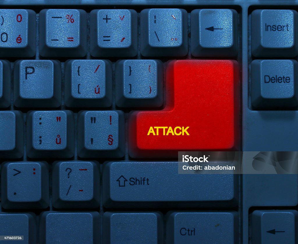 Keyboard with red key. Dirty blue keyboard with red notice Attack. Terrorism online concept. 2015 Stock Photo