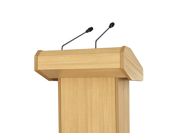 istock Conference meeting microphones with tribune on white background. 471603854