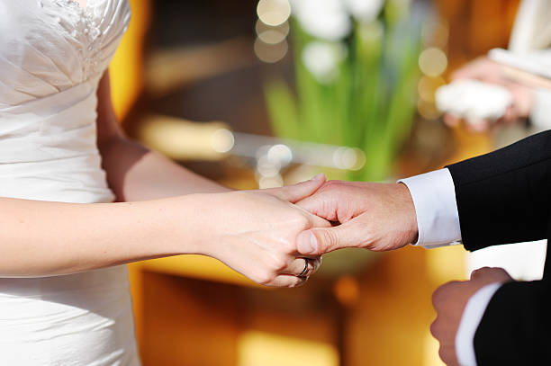istock Bride and groom holding hands on the wedding 471603935