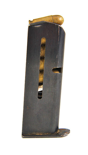 istock Gun magazin or cartridge with bullets isolated on a white 471604454