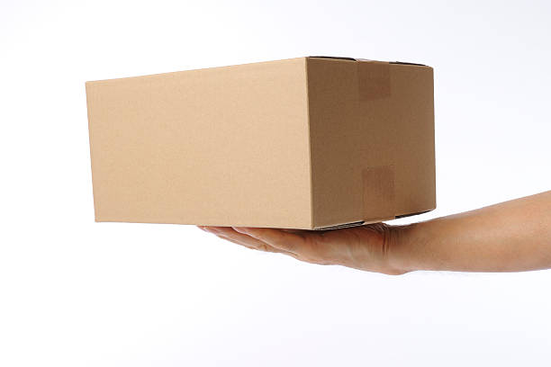 istock Isolated shot of delivering a cardboard box on white background 471604519