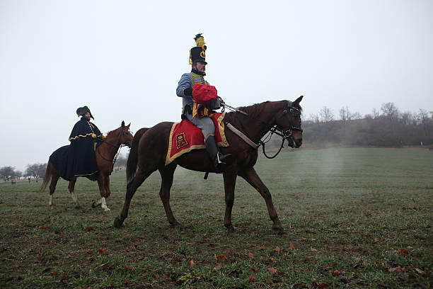Tvarozna, Czech Republic - December 3, 2011: Re-enactors uniformed as Austrian cavalry attend the re-enactment of the Battle of Austerlitz (1805) near Tvarozna, Czech Republic.