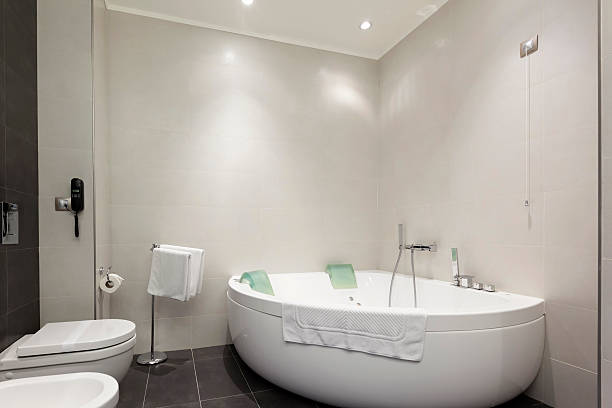 istock Hotel bathroom interior with hot tub 471605748