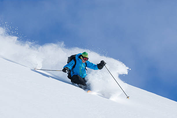 Get Some Fresh Powder Powder skiing light and fluffy beautiful un-tracked lines extreme skiing stock pictures, royalty-free photos & images