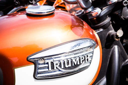 Forli, Italy - June 2, 2013: Triumph detail logo into a tank of motorcycle. No people . Triumph is an UK motorcycle manufacturer ,it was established in 1984 by John Bloor.