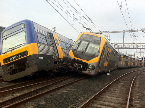 Sydney, Australia - October 10, 2011: Two Sydney trains crash in the  Sydney's Eveleigh maintenance rail yards in the early morning hours. The two trains, one an electric Millennium set and the other an outer suburban Endeavour set crashed during shunting.