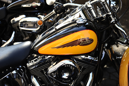 Rome, Italy - June 16, 2013: Harley Davidson Motorcycle Fuel Tank with brand logo and a shiny engine with chrome cover.Harley Davidson is an American motorcycle manufacturer founded in Milwaukee during the early 1900. Shot at the Harley Davidson 110th anniversary celebrations.