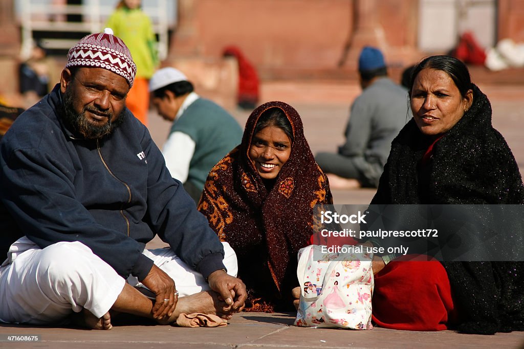 Muslim family Dehli, India- February 11, 2008: Muslim family on pilgrimage to Jama Masjid mosque on February 11, 2008 in Dehli, India. Jama Masjid is the largest mosque in India with millions of visitors each year. Adult Stock Photo