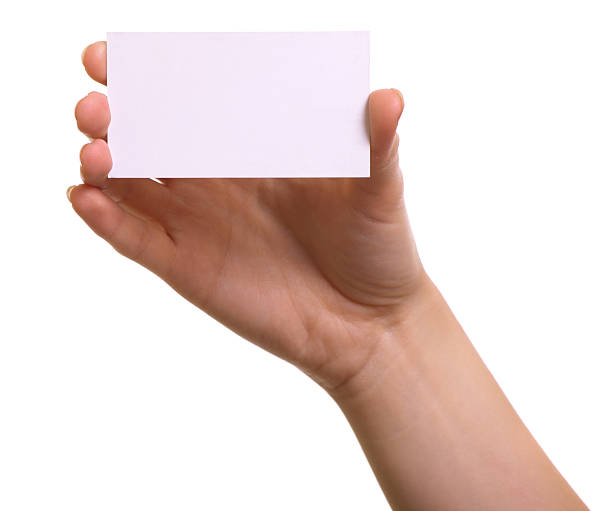 istock Paper card in woman hand isolated on white background 471609459
