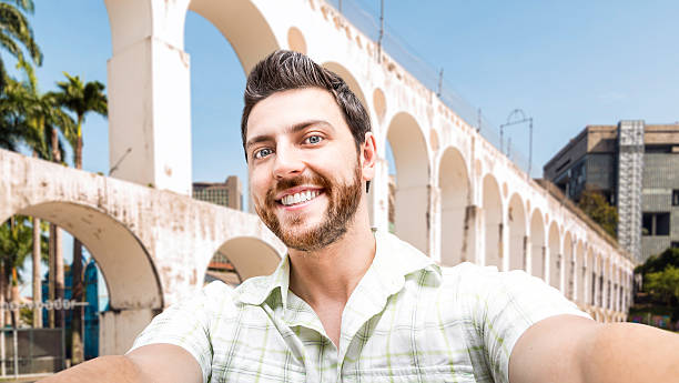 istock Young man taking a selfie photo in Rio de Janeiro 471609528