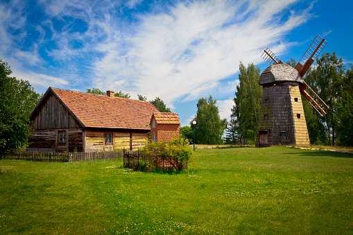 Old small farmhouse with red roof tile and windmill, Osiek nad Notecią, Wielkopolska, Poland
