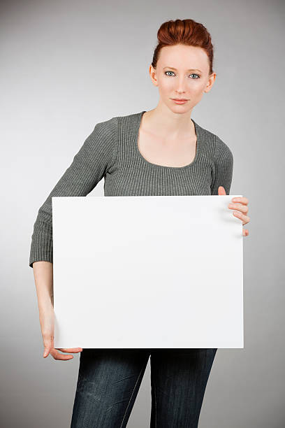 Casual Young Woman with Sign Isolated on White Background 