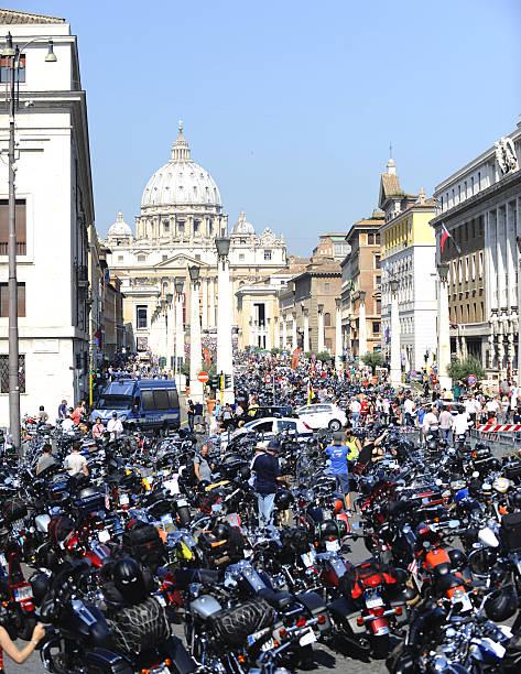 Harley Davidson - 110th anniversary celebrations Rome, Italy - June 16, 2013: Hundreds of Harley Davidson Motorcycles parked in front of  St. Peters Square (Vatican) on Sunday as Pope Francis blessed thousands of Harley-Davidsons and their riders celebrating the manufacturer's 110th anniversary with a loud parade .  harley davidson fat boy stock pictures, royalty-free photos & images