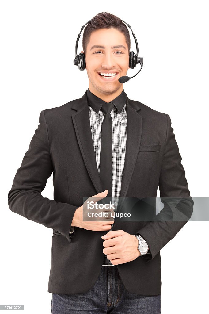 Handsome male customer service operator wearing a headphones and microphone A handsome male customer service operator wearing a headphones and microphone isolated on white background Receptionist Stock Photo