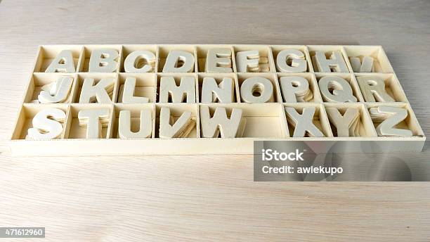 Unpainted Wooden Alphabet Letter Set In Boxes Of Compartment Stock Photo - Download Image Now