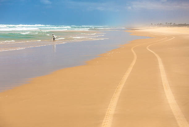 wheel traces in the sand Fisherman and wheel traces on sand, Senegal senegal beach stock pictures, royalty-free photos & images