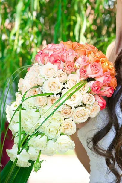 Wedding bouquet in hands of the bride.