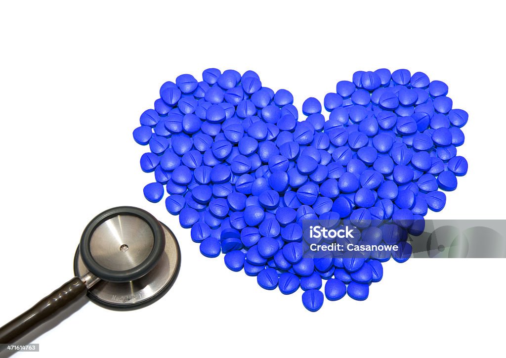 Doctors Stethoscope With blue Drugs In Pill Form Doctors Stethoscope With Medical Drugs In Pill Form Cut Out Stock Photo