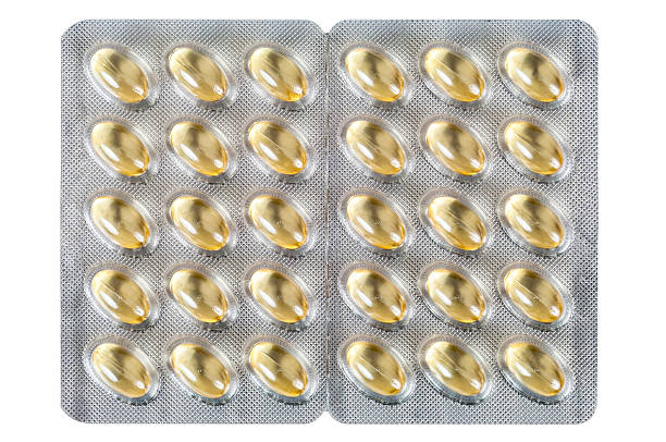 肝油カプセルで、白背景 - fish oil vitamin pill cod liver oil nutritional supplement ストックフォトと画像