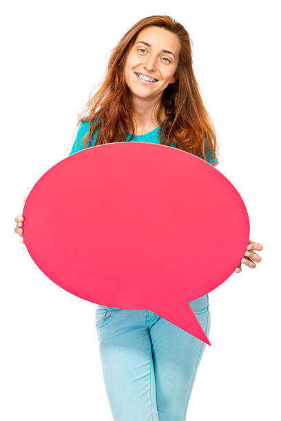 istock Young girl holding big purple speech bubble 471617791