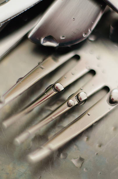 Wet steel fork. stock photo
