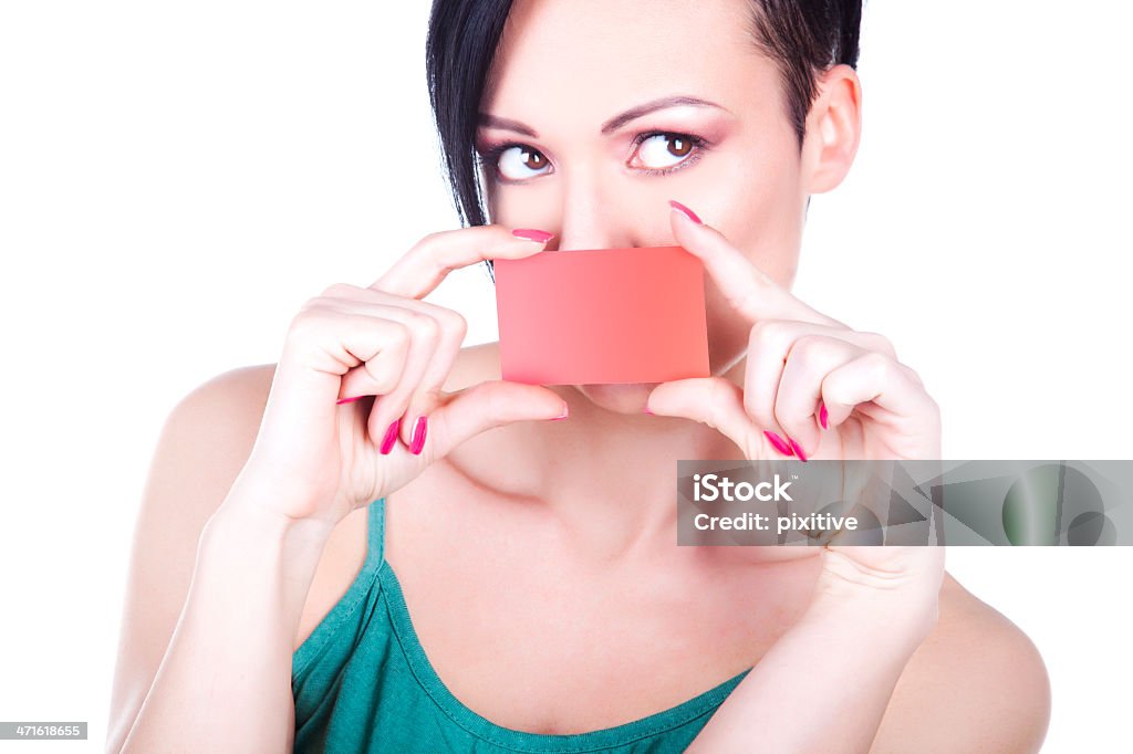 Woman Holding Gift Card Photo of a casual woman showing a blank gift card (or credit card). Adult Stock Photo