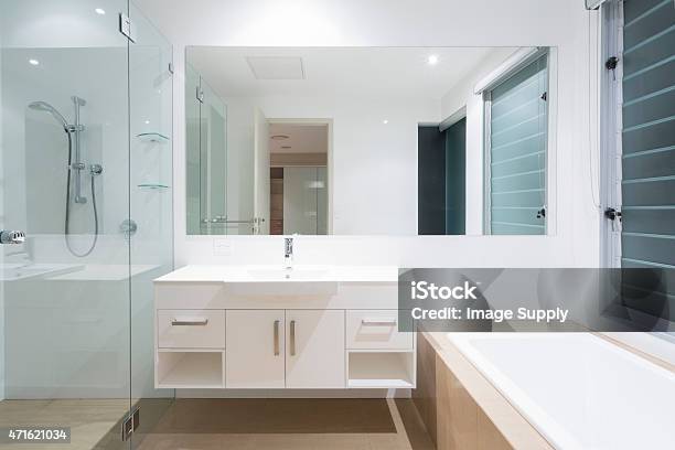 Modern Bathroom View Of Mirror Above Sink And Next To Shower Stock Photo - Download Image Now