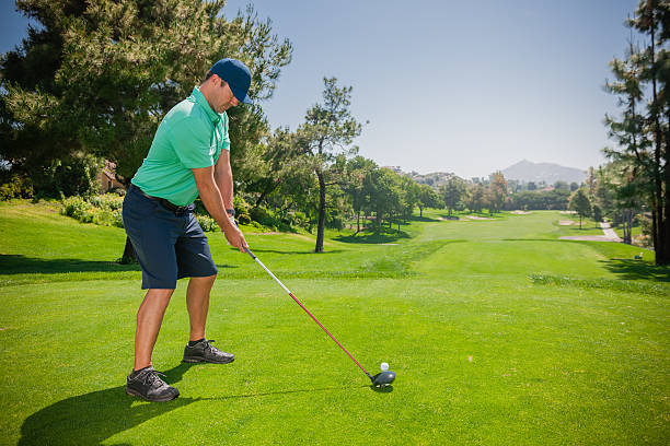 istock Golfer At Top Of Swing 471622631