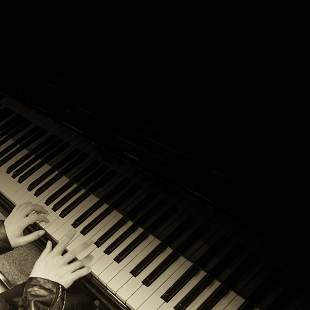 istock Asian woman playing piano 471623577