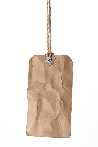Vintage tag wrinkled Cardboard tag in white background old luggage tag stock pictures, royalty-free photos & images