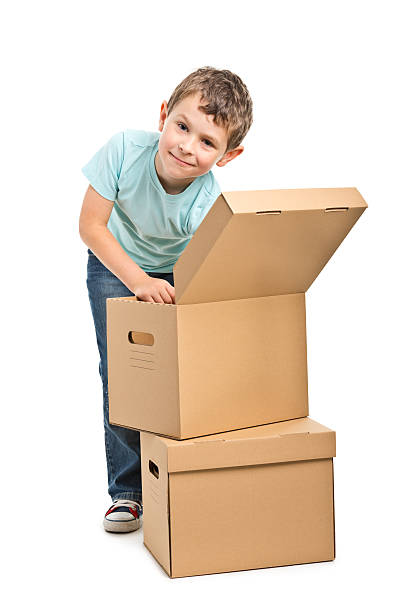 istock portrait of small boy with boxes 471625611