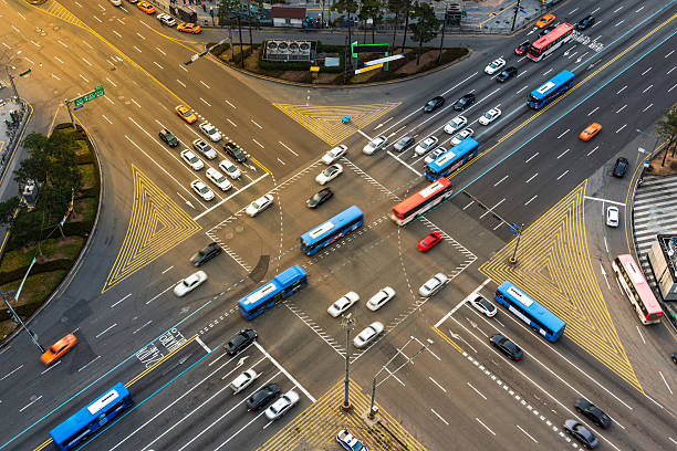Gangnam Traffic Rush hour traffic zips through an intersection in the Gangnam district of Seoul, South Korea. seoul bus stock pictures, royalty-free photos & images