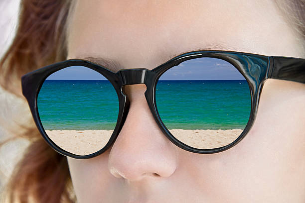 istock Sea reflection in a girl sunglasses 471625974