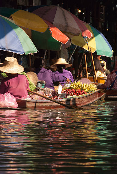 istock Fruit vendors and colourful umbrellas - Thailand 471626031