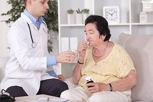 istock Senior woman taking medicine. 471626697