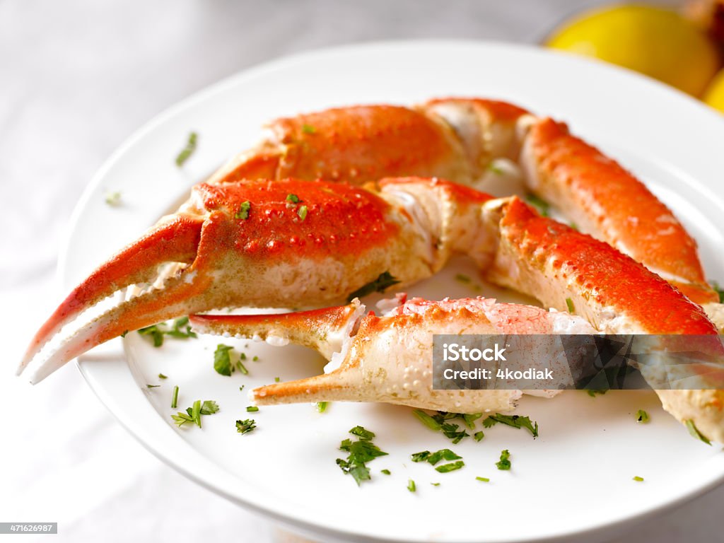King Crab Dinner King Crab Plate with Grilled Prawn. Butter Stock Photo