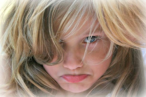 istock Young girl with a sad face 471627323