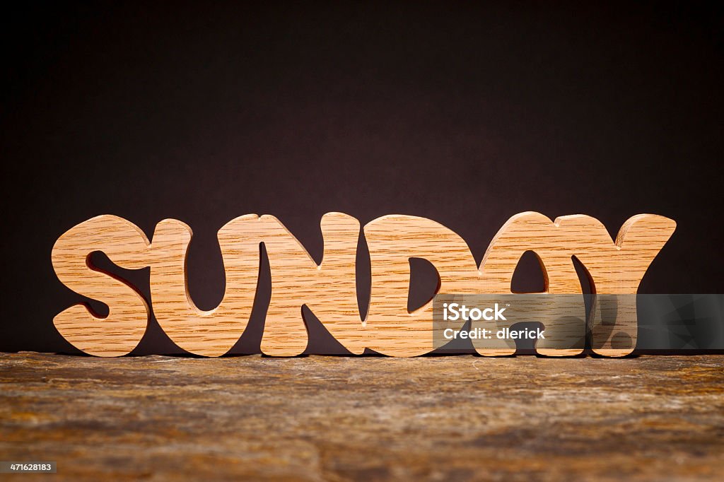 Day of the Week: Sunday SUNDAY: Day of the week, hand cut from solid oak wood. Alphabet Stock Photo
