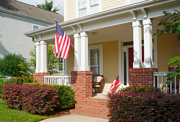 istock Front Porch with an American Flag 471628393