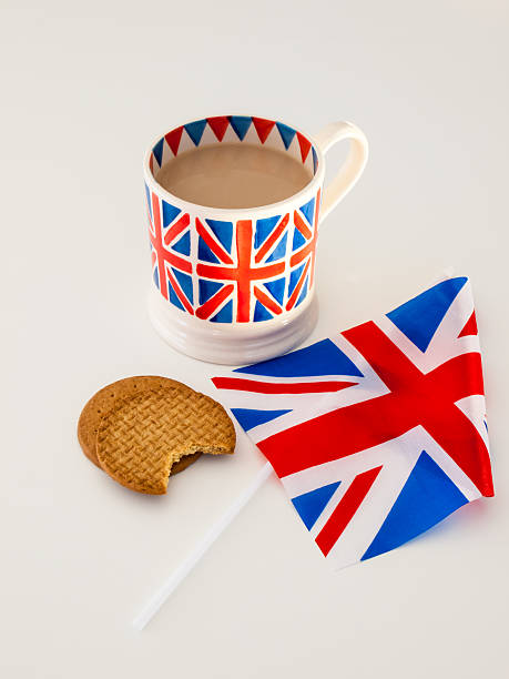 istock cup of English tea and biscuits with a flag 471628793
