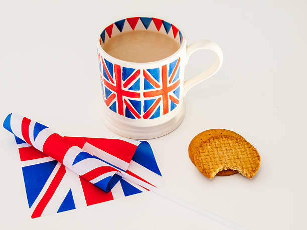istock cup of English tea and biscuits with a flag 471628797